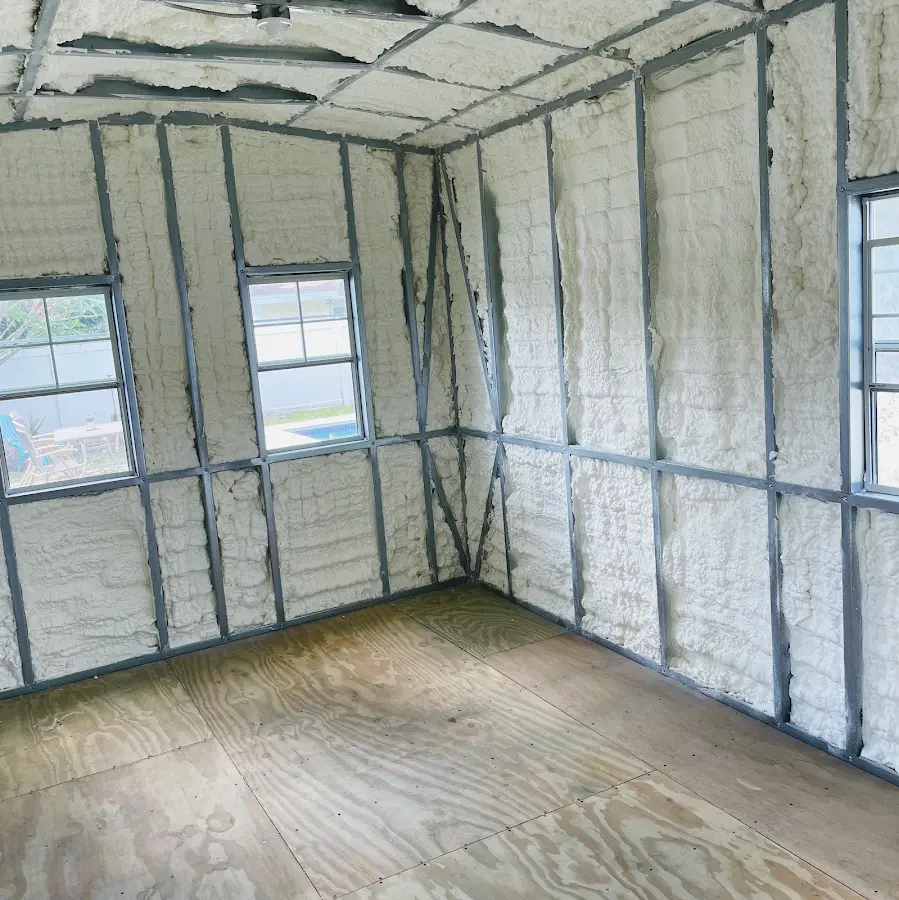 Closed-cell spray foam insulation applied to wall cavities in a residential project in Ada